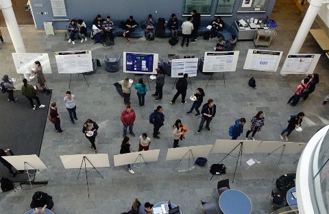 Students present their research as posters at the end of the Explore Computer Science Research program.